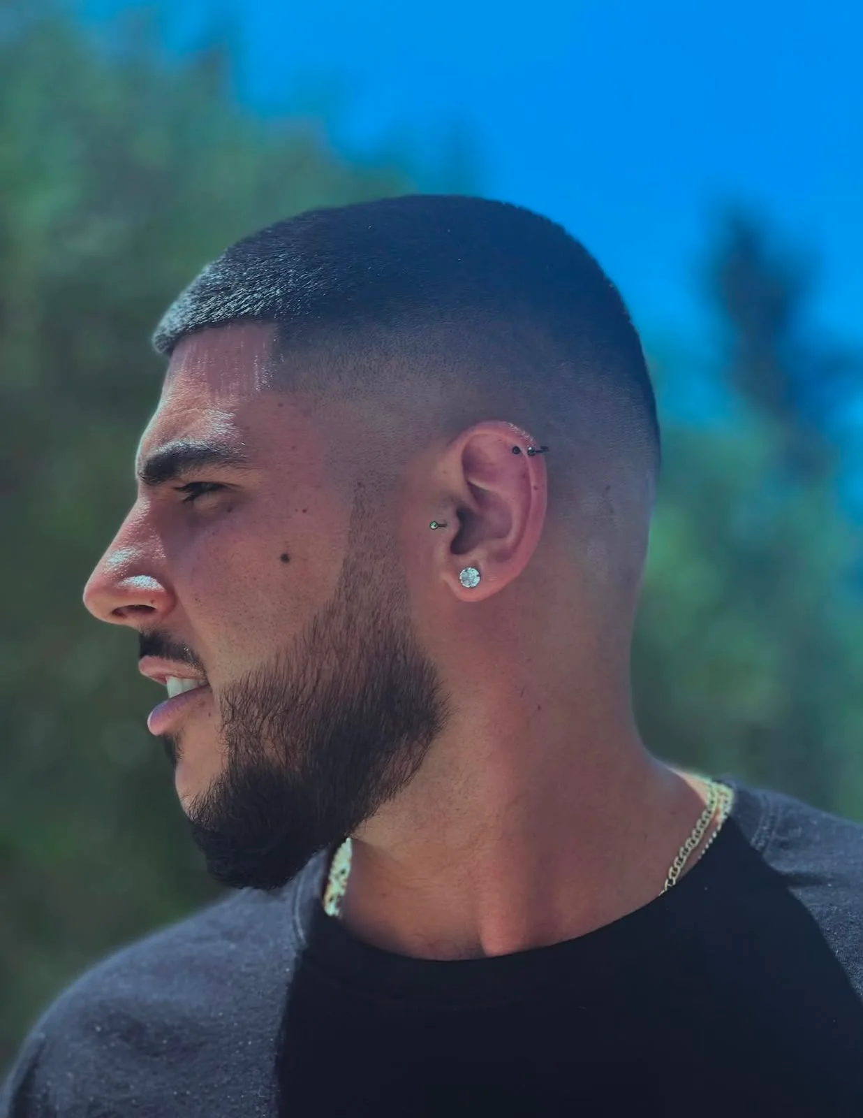 A finished fade and beard profile