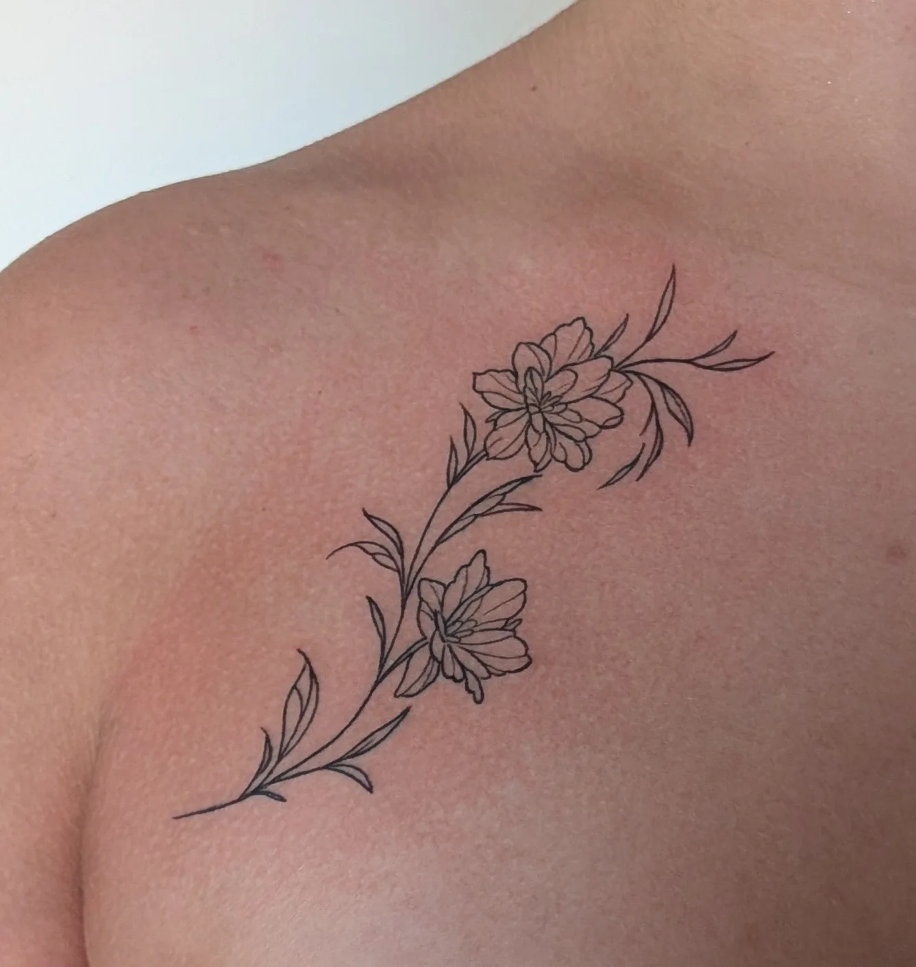 Floral linework tattoo by Just Tattoo It