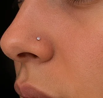 Nose piercing with a small stud